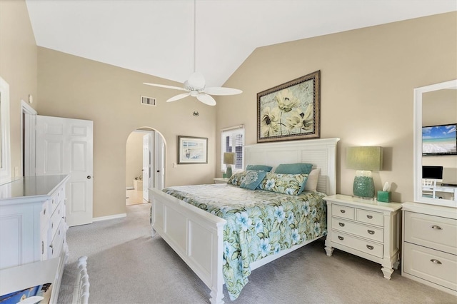 bedroom featuring visible vents, arched walkways, light colored carpet, ceiling fan, and high vaulted ceiling