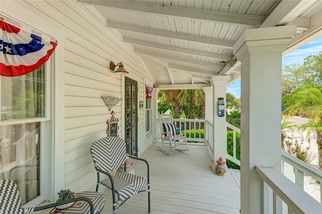 wooden terrace featuring a porch