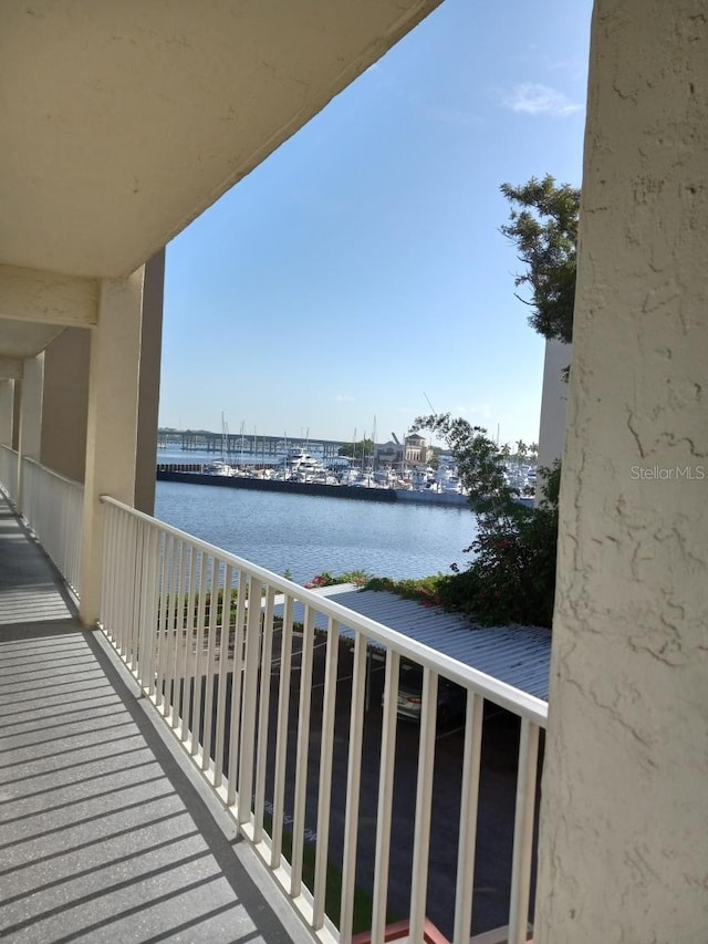 balcony featuring a water view