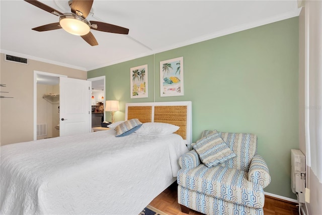 bedroom featuring ornamental molding, parquet floors, and ceiling fan