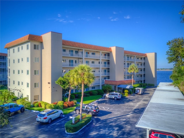 1600 1st Ave W Unit 304A, Bradenton, FL 34205 - view of apartment building / complex featuring uncovered parking
