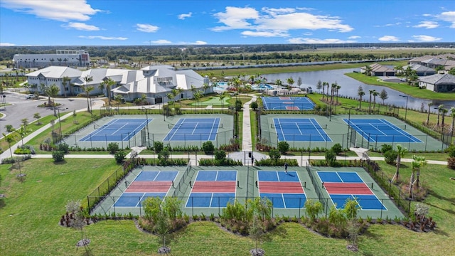 drone / aerial view featuring a water view and a residential view