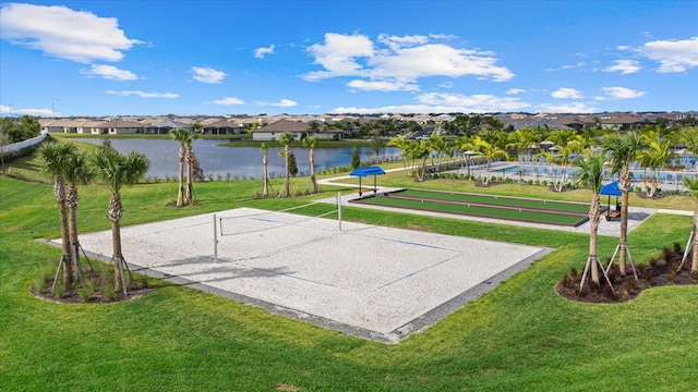 view of home's community featuring a residential view, a water view, a lawn, and volleyball court