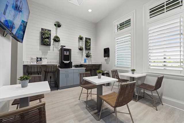 dining room featuring light wood-type flooring, baseboards, and recessed lighting