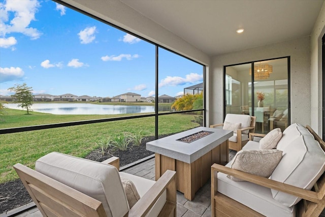 sunroom / solarium with a water view