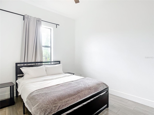 bedroom featuring ceiling fan and wood-type flooring