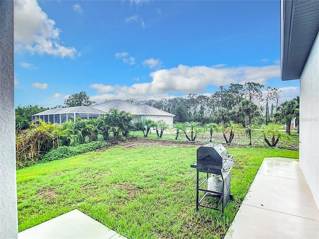 view of yard featuring glass enclosure