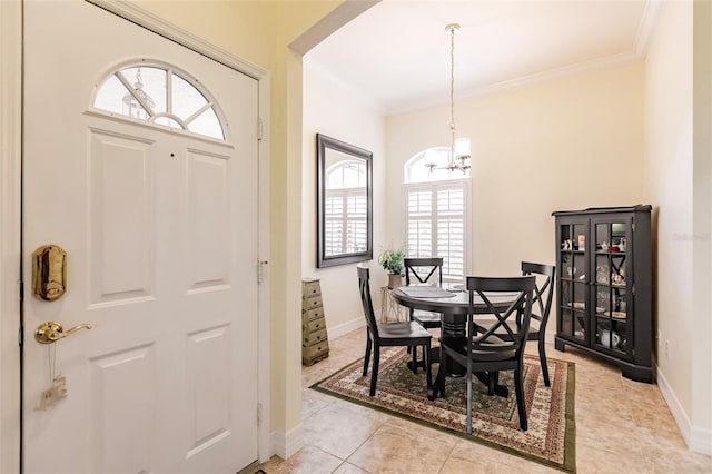 dining area featuring light tile patterned floors, a wealth of natural light, and crown molding