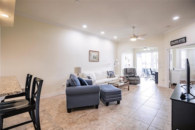 living room featuring ceiling fan, light tile patterned floors, and ornamental molding