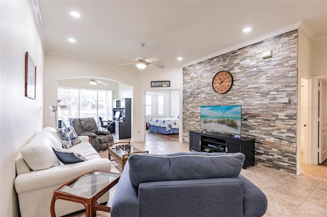 living room with ceiling fan, light tile patterned floors, and ornamental molding