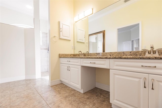 bathroom featuring tile patterned floors, vanity, and crown molding