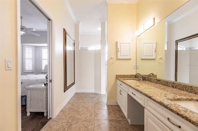 bathroom with ceiling fan, ornamental molding, tile patterned flooring, and vanity