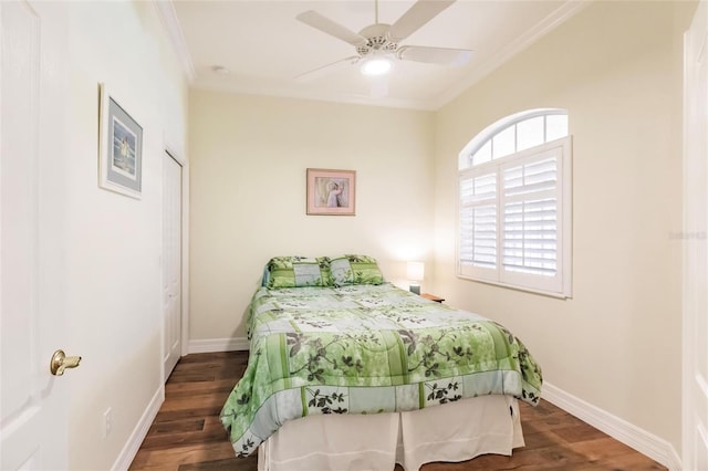 bedroom with ceiling fan, dark hardwood / wood-style flooring, and crown molding