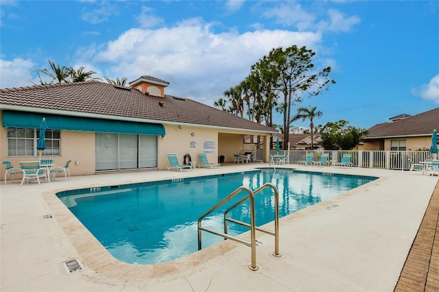 view of swimming pool with a patio area