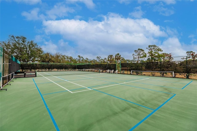 view of sport court featuring basketball hoop