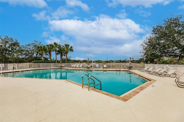 view of pool featuring a patio area