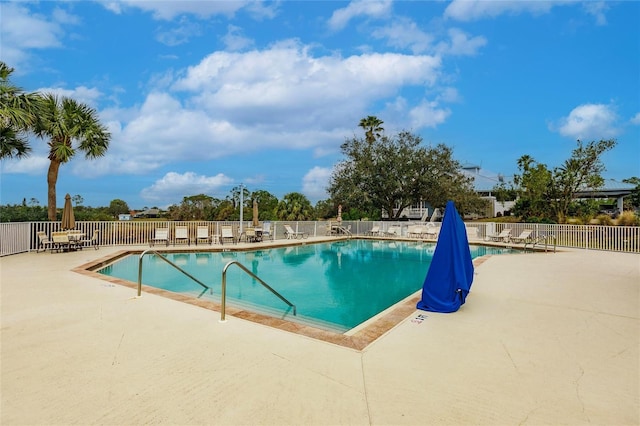 view of pool featuring a patio