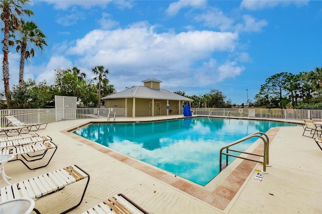 view of swimming pool with a patio area