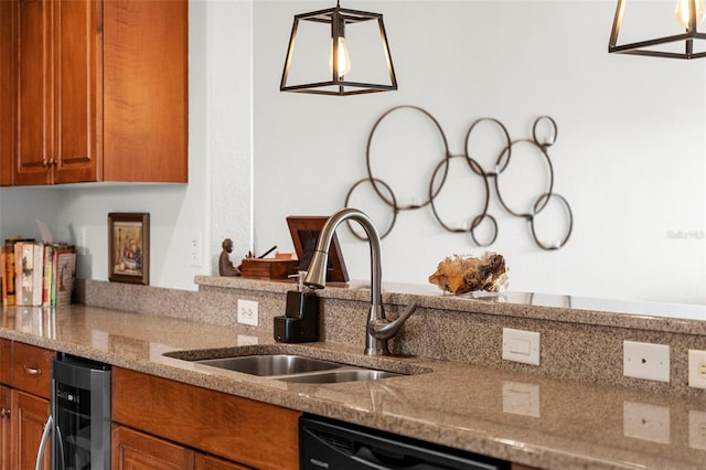 kitchen with sink, light stone counters, decorative light fixtures, black dishwasher, and beverage cooler