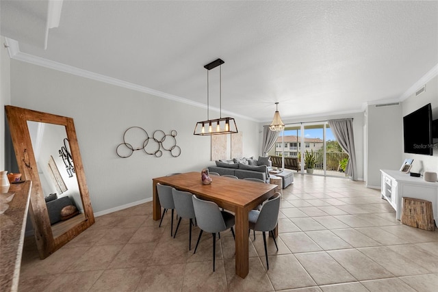 dining area featuring crown molding, light tile patterned floors, and a textured ceiling