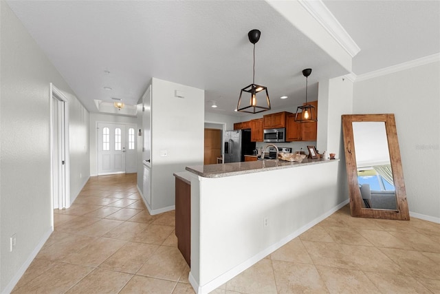 kitchen featuring pendant lighting, light tile patterned floors, appliances with stainless steel finishes, ornamental molding, and kitchen peninsula