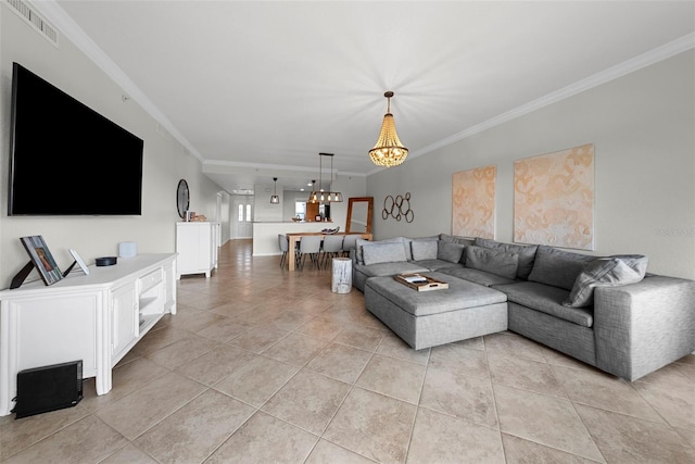 tiled living room featuring a notable chandelier and ornamental molding