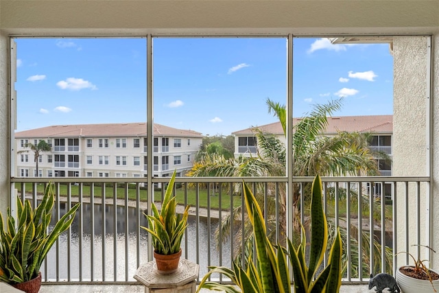 balcony featuring a water view