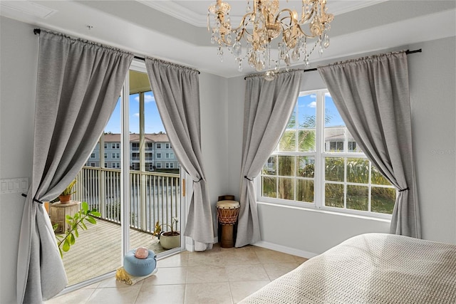 bedroom with light tile patterned flooring, ornamental molding, a raised ceiling, and access to outside