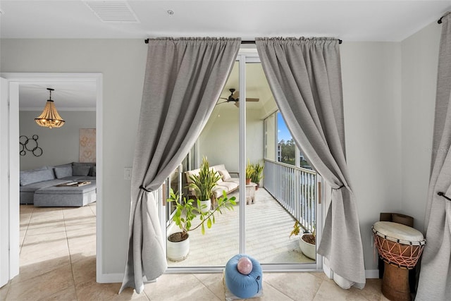 interior space featuring ceiling fan and ornamental molding