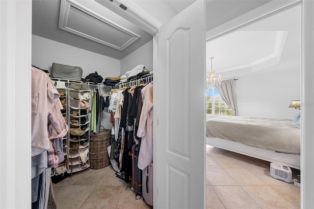 spacious closet with light tile patterned floors