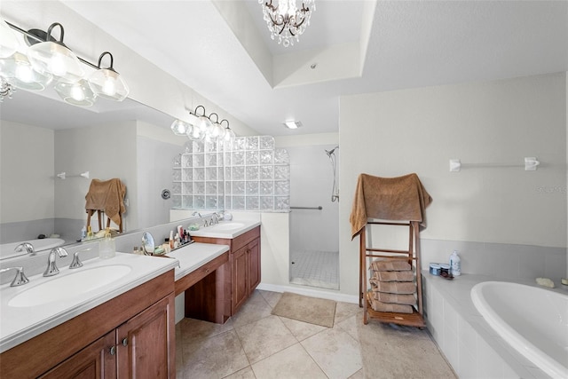 bathroom with a notable chandelier, shower with separate bathtub, tile patterned floors, and vanity