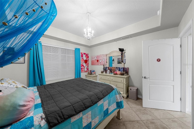 tiled bedroom featuring a textured ceiling and a chandelier