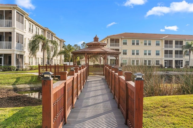 surrounding community featuring a gazebo and a lawn