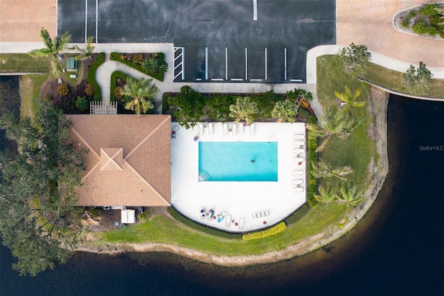 birds eye view of property featuring a water view