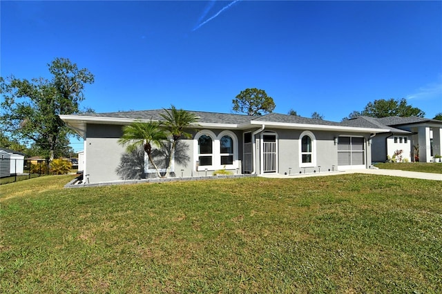 ranch-style house with a front lawn and a garage