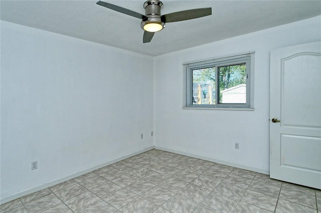 spare room featuring ceiling fan