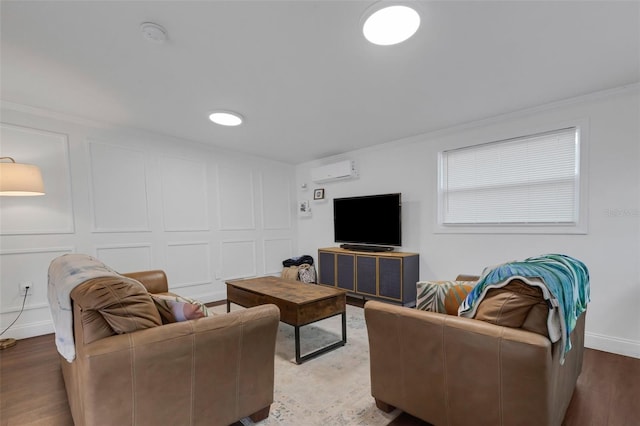 living room featuring a wall mounted AC, ornamental molding, and wood-type flooring