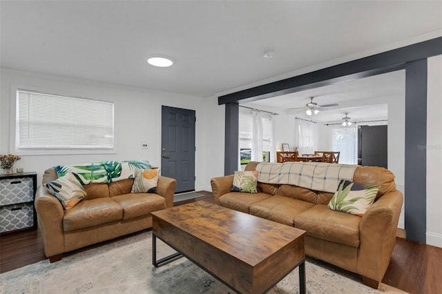 living room with crown molding and light hardwood / wood-style flooring