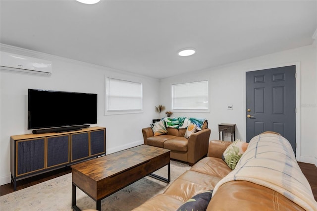 living room with a wall mounted AC, ornamental molding, and hardwood / wood-style floors