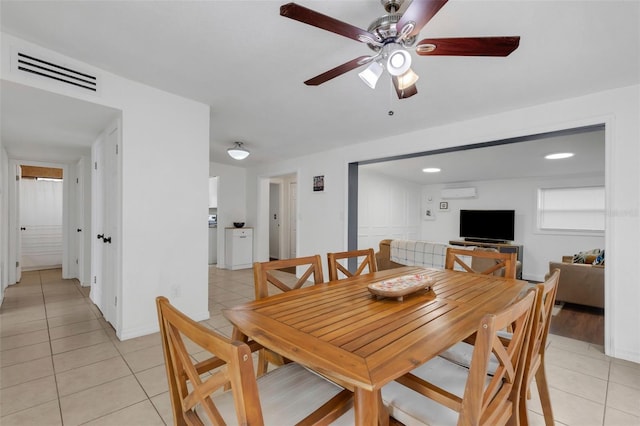 tiled dining room featuring ceiling fan