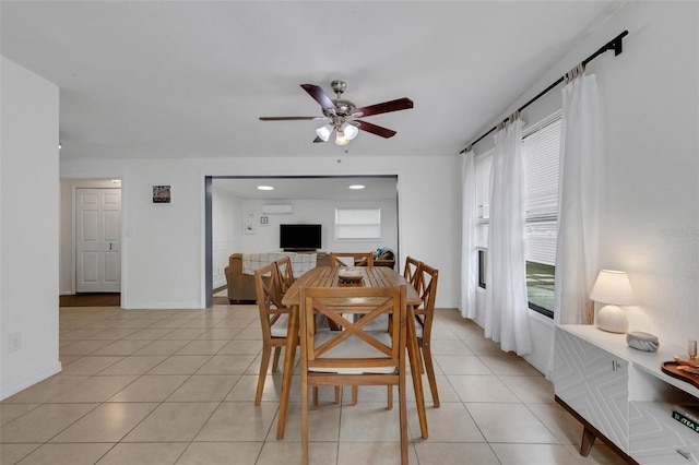 tiled dining room featuring ceiling fan