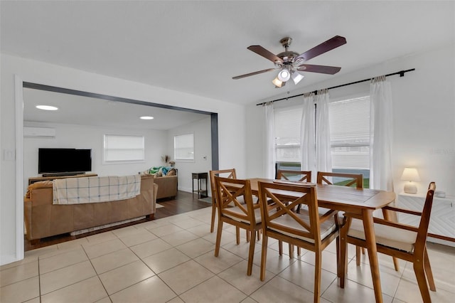 tiled dining space with ceiling fan