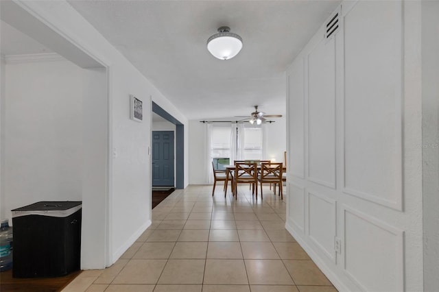 corridor featuring light tile patterned flooring