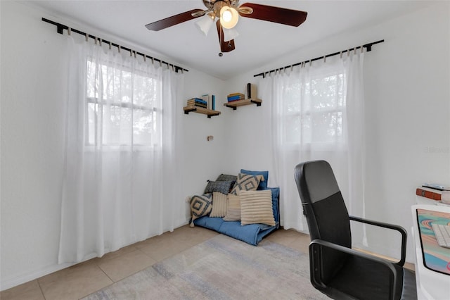 office area with ceiling fan and light tile patterned floors