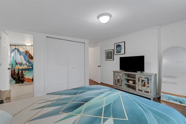 bedroom featuring a closet and ornamental molding