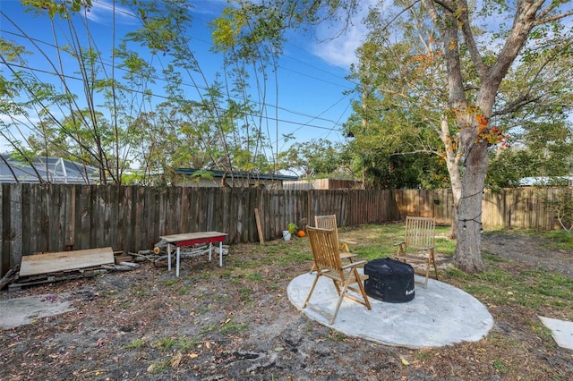 view of yard with an outdoor fire pit