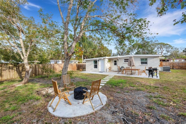 rear view of house featuring an outdoor fire pit and a patio