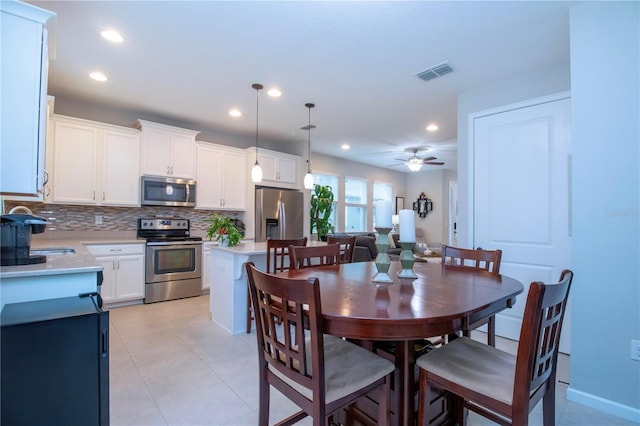 11728 Meadowgate Pl, Bradenton, FL 34211 - dining space with ceiling fan, recessed lighting, and light tile patterned flooring