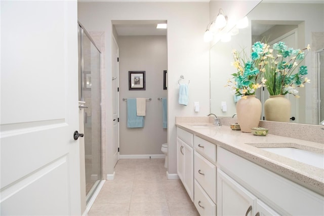 11728 Meadowgate Pl, Bradenton, FL 34211 - bathroom with double vanity, a stall shower, tile patterned flooring, and toilet