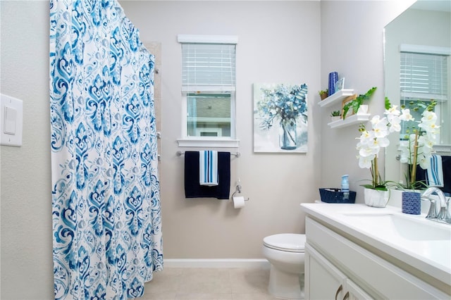 11728 Meadowgate Pl, Bradenton, FL 34211 - full bath with vanity, toilet, tile patterned flooring, a shower with shower curtain, and baseboards